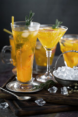 Cocktail in a glass with fruit on an old background.