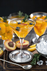 Fruit cocktail, in a glass with natural healthy fruits on a table with kitchen accessories.