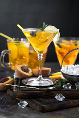 Fruit cocktail, in a glass with natural healthy fruits on a table with kitchen accessories.