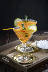 Fruit cocktail, in a glass with natural healthy fruits on a table with kitchen accessories.