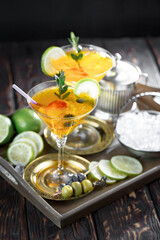 Refreshing summer alcoholic cocktail with crushed ice and citrus fruits