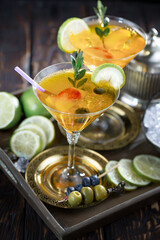 Refreshing summer alcoholic cocktail with crushed ice and citrus fruits