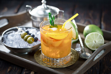 Refreshing summer alcoholic cocktail with crushed ice and citrus fruits