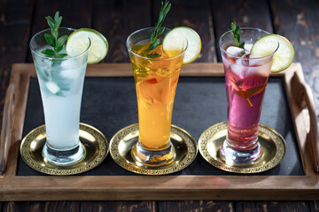 Fruit cocktail, in a glass with natural healthy fruits on a table with kitchen accessories.