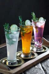 Cocktail in a glass with fruit on an old background.
