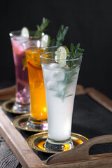 Fruit cocktail, in a glass with natural healthy fruits on a table with kitchen accessories.