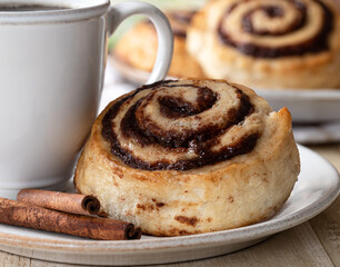 Cinnamon roll and cup of coffee