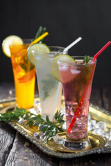 Fototapeta premium Refreshing summer alcoholic cocktail with crushed ice and citrus fruits