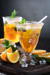 Fototapeta premium Refreshing summer alcoholic cocktail with crushed ice and citrus fruits