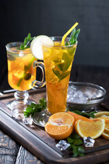 Refreshing summer alcoholic cocktail with crushed ice and citrus fruits