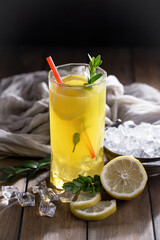 Cocktail in a glass with fruit on an old background.