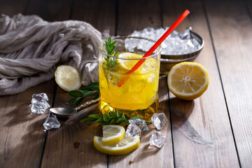 Cocktail in a glass with fruit on an old background.
