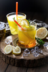 Fototapeta premium Refreshing summer alcoholic cocktail with crushed ice and citrus fruits