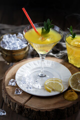Refreshing summer alcoholic cocktail with crushed ice and citrus fruits