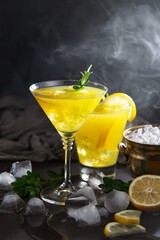 Cocktail in a glass with fruit on an old background.