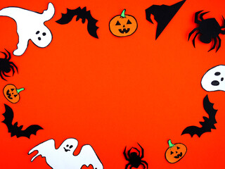 Festive background for Halloween. Ghost, pumpkin, witch hat, bats on an orange background. Place...