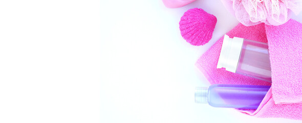 Long white banner with skincare products in pink and purple tones. Spa set. Flat layout. Corner filling. Place for your text.