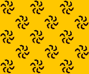 The silhouette of bats is assembled into a round flower. Seamless autumn pattern on orange background for Halloween. Gift wrapping paper for Halloween. Halloween textiles.