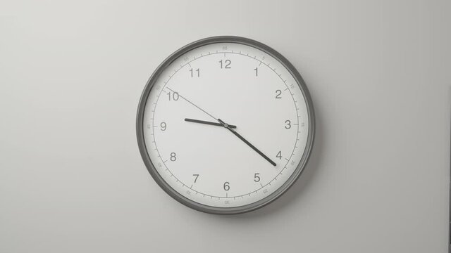 Clock Face on Dark White Office Wall in Timelapse