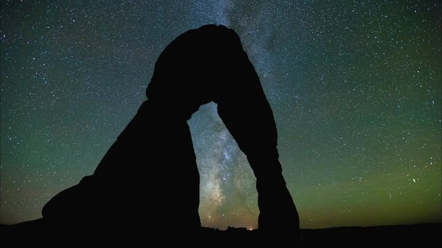 Time Lapse Silhouette Of Rock Formation Against milky way, Comets Moving In Sky During Night - Vancouver, Canada
