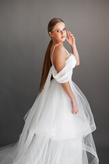 Fototapeta premium Beautiful bride. Wedding hairstyle and make up. Fashion wedding dress