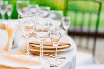 classic empty wine glasses on a round table. Banquet serving. catering 