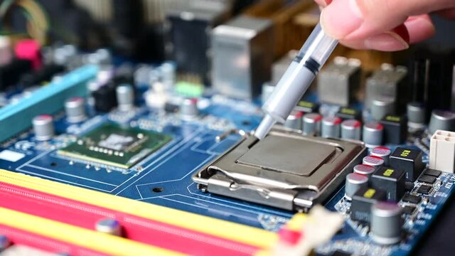 close-up Thermal compound on cpu chip in mainboard computer