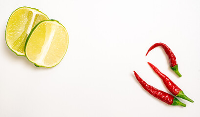 Lime and Chilli Peppers on White Background