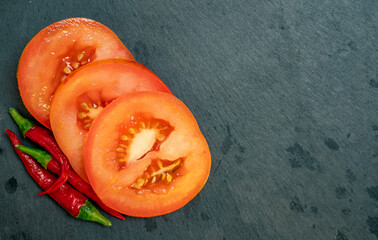 Tomato and Chilli Peppers on Black Slate Tile