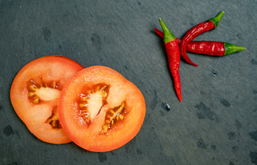 Tomato and Chilli Peppers on Black Slate Tile