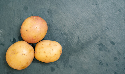Potato on slate tile