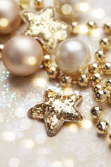 Fototapeta na wymiar shiny gold christmas ornaments. celebration concept for postcard or invitation