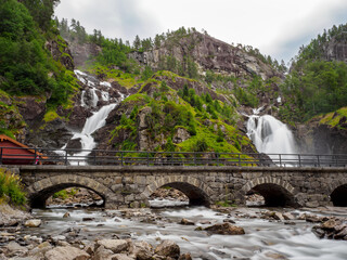 View on Langfossen waterfall in summer, Etne, Norway