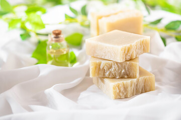 Natural handmade soap on white silk. Aromatic natural soap. Organic soap.