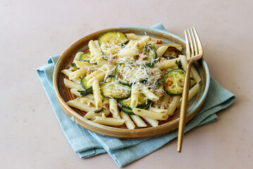 Penne pasta with zucchini, sage, nuts and parmesan cheese. Healthy eating. Vegetarian food. Italian food.