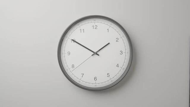 Clock Face on Dark White Office Wall in Timelapse