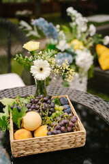 Dessert table for guests at the event, decorated with flowers