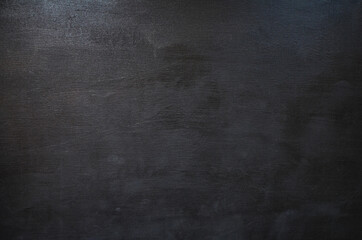 Black concrete wall texture. Painted concrete background. Top view.