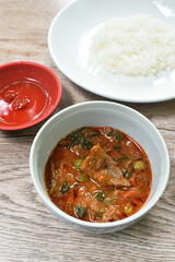 beef meat curry with eggplant in coconut milk or Panang Thai food on bowl with rice