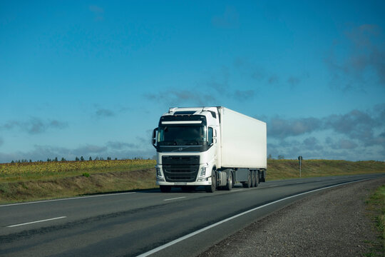 Volvo Truck driving on the asphalt road in summer rural landscape. Belgorod , Russia - SPT 2, 2021: