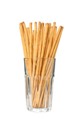 Delicious grissini sticks in glass on white background