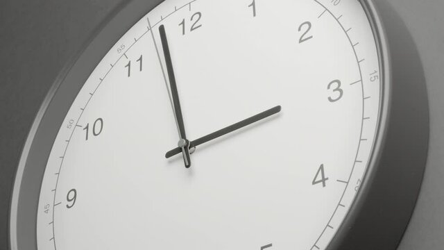 Clock Face on Dark Grey Office Wall in Timelapse