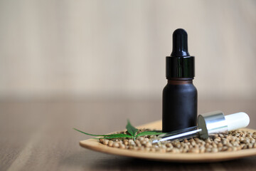 Obraz na płótnie Canvas CBD oil hemp products, Medicinal cannabis with extract oil in a bottle. Medical cannabis concept