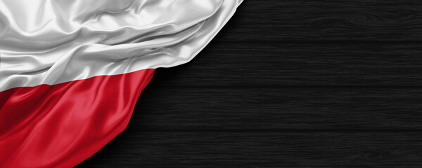 Close Up of Poland flag on the black wooden background 3D render