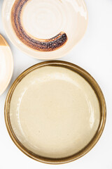 Close of brown tone and vintage porcelain plate isolated on white