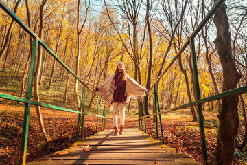 Woman relaxing in nature on sunny autumn day