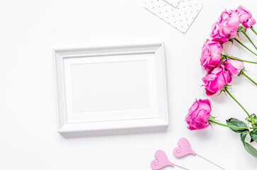 present design with peony bouquet and white frame top view mock up