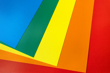folded sheets of cardboard paper in vivid colors. Bright abstract background