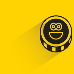 coin emoticon with shadow on yellow background