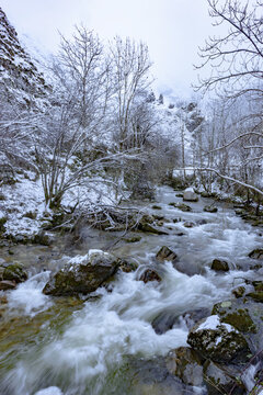 Small river in snowy mountains